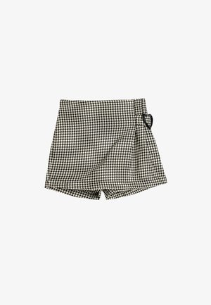 Shorts à motif pied-de-poule noir et blanc avec une taille haute et un accent en forme de cœur sur le côté. Tissu texturé, design ajusté.