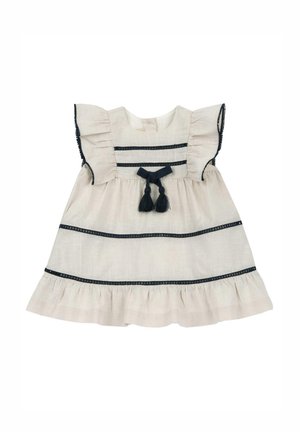 Jasno beżowa sukienka z krótkimi falbaniastymi rękawami, granatowymi paskami i zebrańkiem na dole. Posiada ozdobną kokardę i frędzle z przodu.