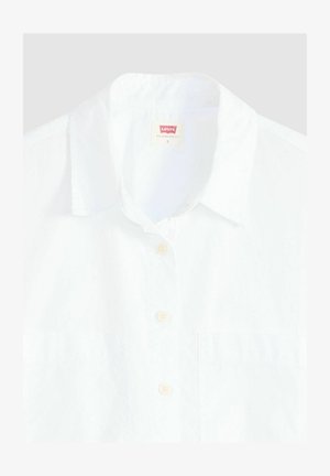 Camicia bianca con colletto classico. Realizzata in tessuto leggero, presenta un design semplice e bottoni beige. Include un'etichetta Levi's.