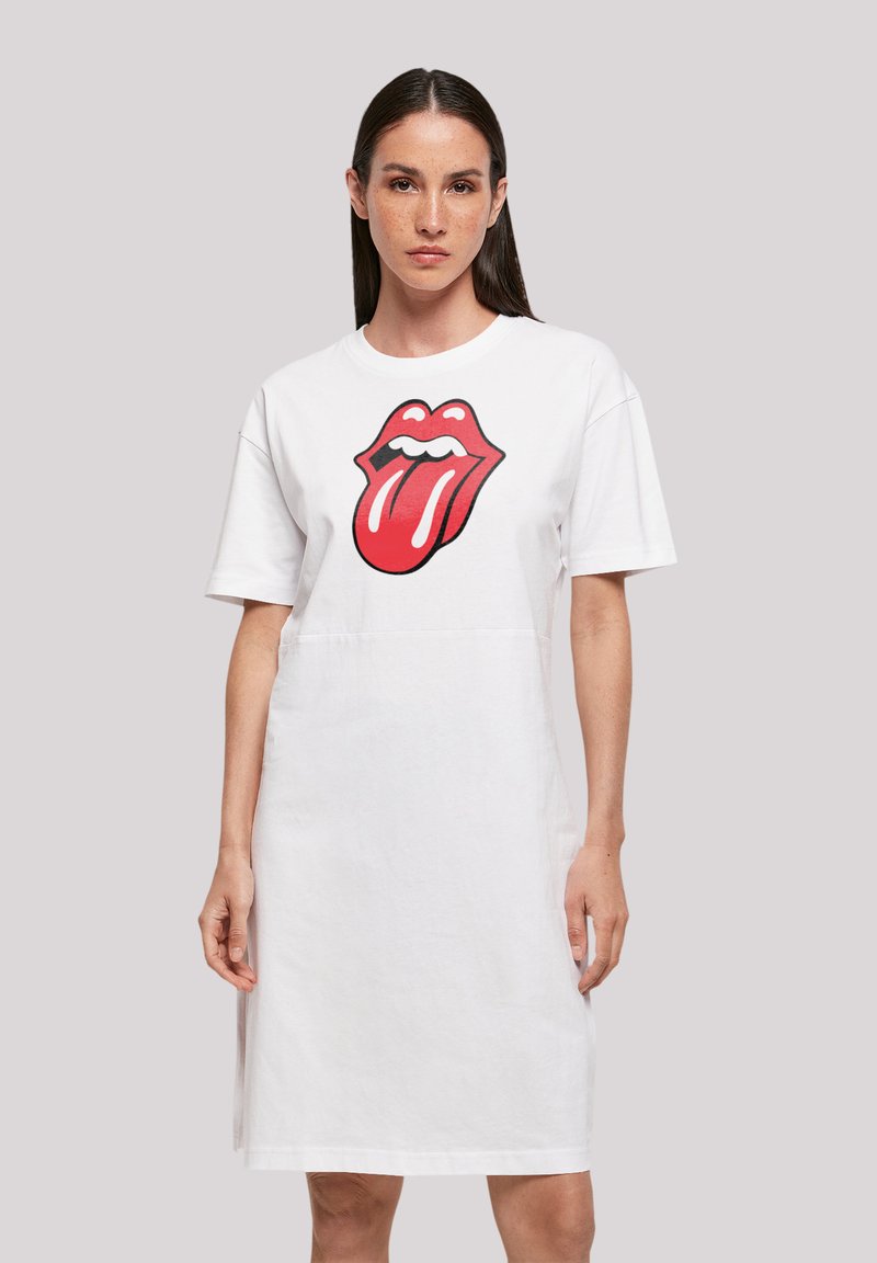 Weißes Baumwoll-T-Shirt-Kleid mit einem großen roten Rolling Stones-Logo-Graphic. Kurze Ärmel und eine lockere Passform. Glatte Textur, knielang.