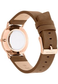 Brauner Lederarmbanduhr mit einem runden Gehäuse aus Roségold, glatter Oberfläche und einem klaren Mineralglass-Zifferblatt. Verstellbare Schnallenverschluss.