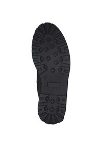 Black rubber sole featuring a textured tread pattern with raised accents and cross-shaped grips for enhanced traction. Manufacturer name visible.