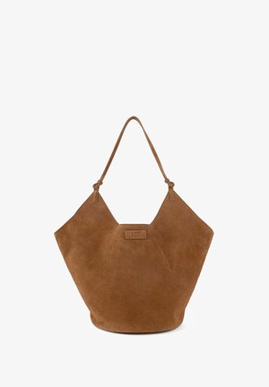 Brown suede shoulder bag with a unique angular shape, featuring a single strap and embossed logo on a front label. Smooth texture.