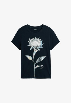 T-shirt noir à manches courtes avec un grand motif fleur métallique argentée et la signature « Desigual » au centre devant.
