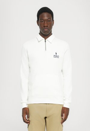 Witte zip-neck sweatshirt met een voorkantzak, voorzien van een marineblauw geborduurd logo "Polo Ralph Lauren" op de linkerborst. Zachte stofstructuur.