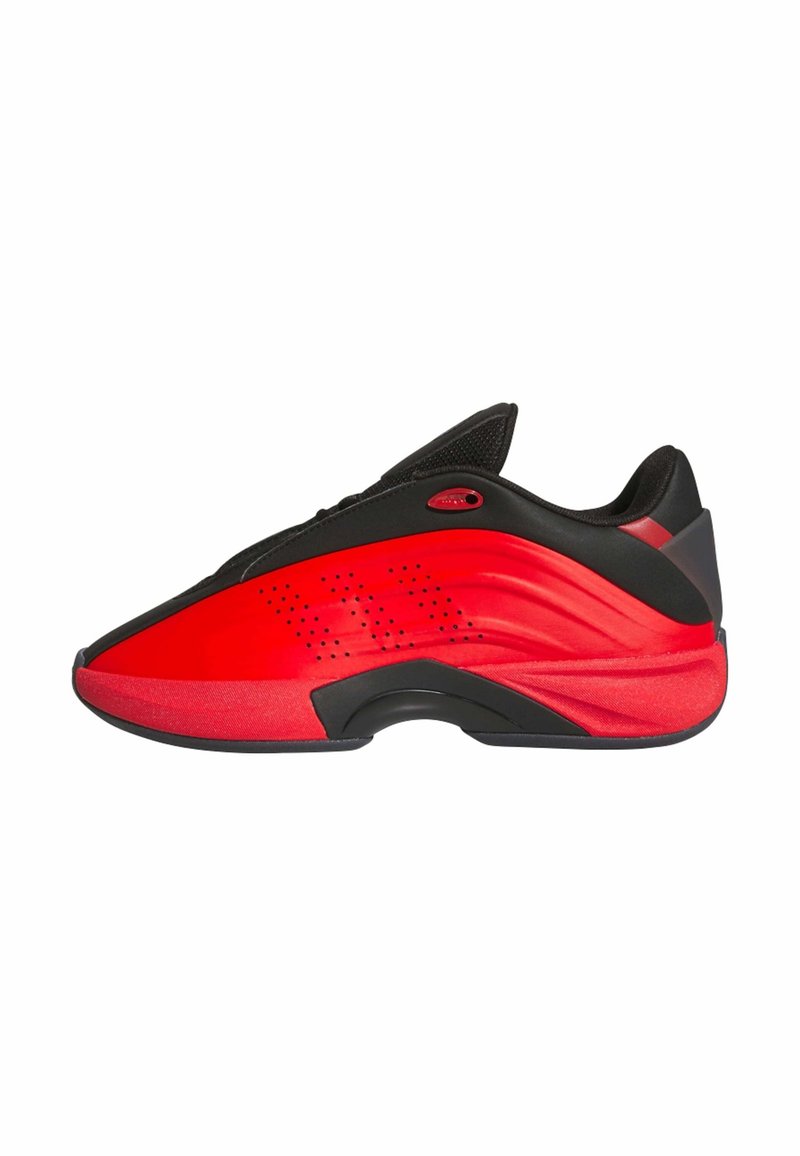 Low-top athletic shoe in red and black with perforated detailing and a curved, sculpted sole designed for sport and casual wear.