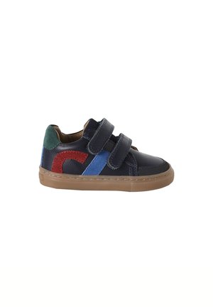 Children's navy blue sneaker with green, red, and blue suede details, two Velcro straps, and a brown rubber sole.