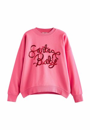 Roosa dressipluus ümmarguse kaelusega, langetatud õlgadega ja lahtise sobivusega. Omab läikivat, sequins'iga kaunistatud "Santa Baby" teksti tumedas värvitoonis.