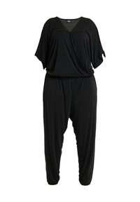 Combinaison noire à manches courtes chauve-souris, col en V, taille froncée et jambes larges et fuselées, présentée sur fond blanc.