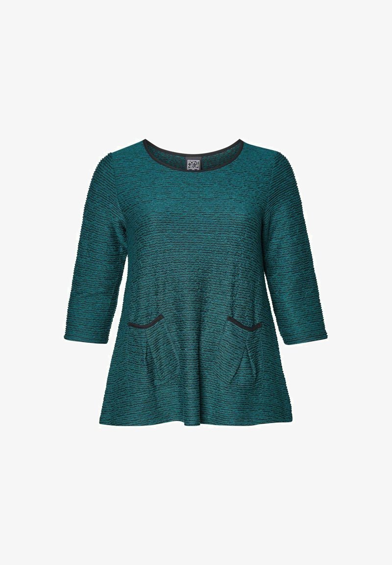 Türkise Tunika mit einem strukturierten Wellenmuster, schwarzem Besatz am Halsausschnitt und zwei vorderen Taschen. Dreiviertelärmel, lockere Passform.