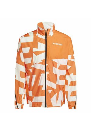 Orange and white patterned jacket with a high collar, full zip, and black zipper accents. Features a lightweight, smooth texture.
