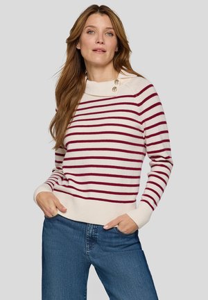 Striped sweater in cream and burgundy with a cowl neck, featuring buttons on the shoulder. Soft knit, fitted at the waist, complementing denim.
