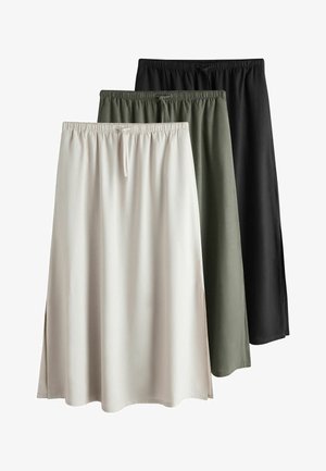 Kolme pitkää hametta beigen, oliivinvihreän ja mustan sävyissä, joissa on joustovyötärö ja sivuhalkiot, aseteltuna limittäin valkoisella taustalla.