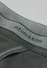 Szary pasek z bawełny z domieszką, z logo "intimissimi", charakteryzujący się szwami płaskimi i gładką fakturą, będący częścią dopasowanej odzieży.