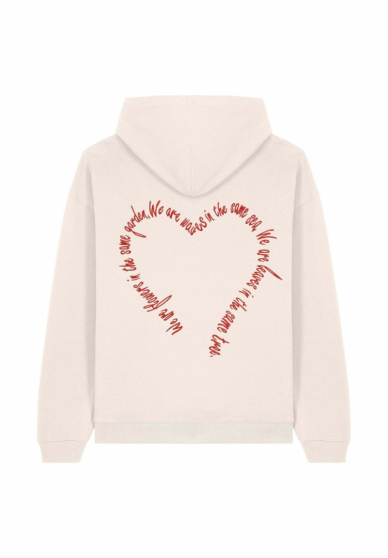 Felpa leggera beige con un design a cuore composto da testo rosso sul retro, caratterizzata da frasi curve che enfatizzano l'unità. Realizzata in un materiale morbido.