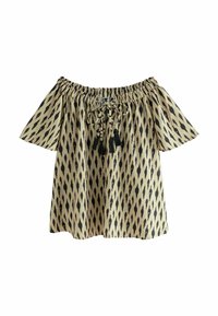 Blouse dénudée d'épaules en tissu léger, présentant un fond beige avec des motifs en losanges noirs, des liens ajustables et des franges.