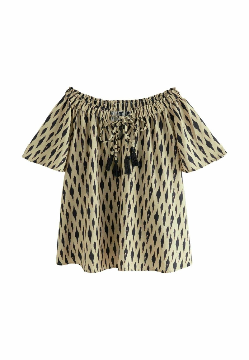 Blouse dénudée d'épaules en tissu léger, présentant un fond beige avec des motifs en losanges noirs, des liens ajustables et des franges.