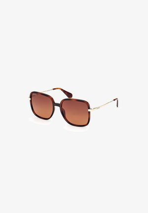 Schildpaddenstulp oversized zonnebril met een gradient bruin getinte lenzen, metalen accenten en dunne gouden monturen.