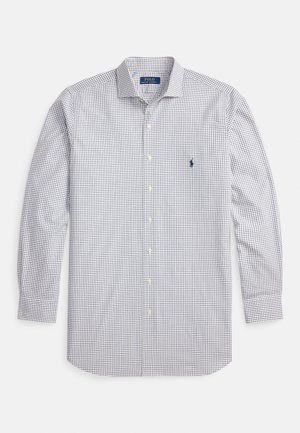 Camisa de manga comprida às quadrículas em branco e azul-marinho, com colarinho abotoado e pequeno logótipo bordado no lado esquerdo do peito. Tecido de algodão.