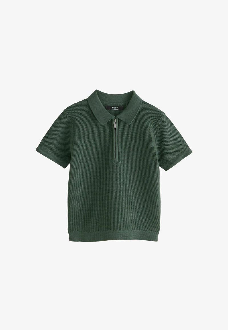 Polo in maglia a maniche corte di colore verde scuro con motivo a rilievo e zip frontale che parte dal colletto.