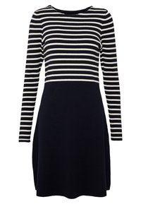 Robe rayée avec des rayures horizontales bleu marine et crème sur le haut, un bas uni bleu marine, des manches longues et un col rond.