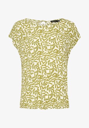 Short-sleeve blouse with green leafy pattern on white fabric, featuring a round neckline and a small keyhole button closure at the back.