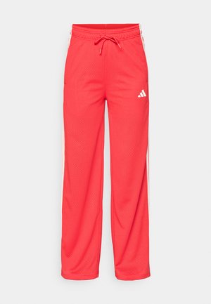 Bright red sports pants with mesh fabric, white side stripes, an elastic waistband with drawstring, and a small white logo on the right thigh.