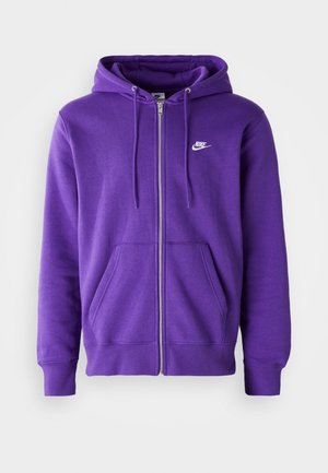 Purple zip-up hoodie made of soft fabric, featuring a kangaroo pocket, drawstring hood, and a small white logo on the chest.