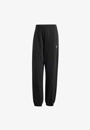 Schwarze Jogginghose aus weichem, strukturiertem Stoff. Sie verfügt über einen elastischen Bund, Bündchen und ein kleines weißes Logo in Hüfthöhe.