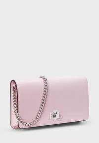 Pink textured leather handbag with a flap design, silver hardware, a chain strap, and logo accent on the front. Stitched edges.