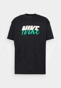Black cotton t-shirt featuring a prominent white and teal Nike logo in an angled design. Short sleeves and crew neck. Soft texture.