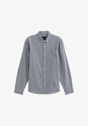 Camicia a maniche lunghe con bottoni in tessuto di cotone a scacchi bianco e nero, dotata di colletto e taschino sul lato sinistro.