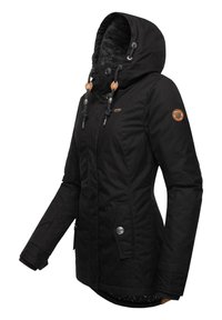Black waterproof jacket with a hood, drawstring details, side pockets, and a textured inner lining. Features branded patches and snap closures.