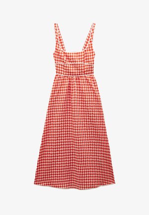 Czerwona i biała sukienka w kratkę z dopasowanym gorsetem, szerokimi ramiączkami i rozkloszowanym dołem. Posiada falbanki wzdłuż szwów.