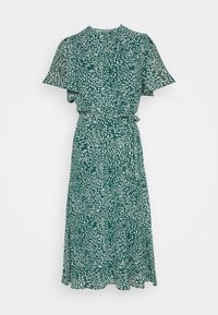 Grön blommig klänning med korta fjäderlika ärmar, en insvängd midja och en flödande kjol. Har ett vitt bladmönster på en mörk bakgrund.