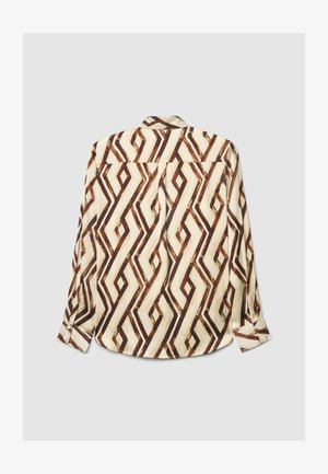 Long-sleeve shirt in cream with a brown geometric pattern. Features a collar, button-up front, and cuffed sleeves. Smooth fabric texture.