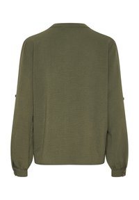 Olívovo zelený top s dlhým rukávom, vyrobený z textúrovanej látky, s okrúhlym výstrihom a gombíkovými detailami na rukávoch. Voľný strih s rovnými okrajmi.