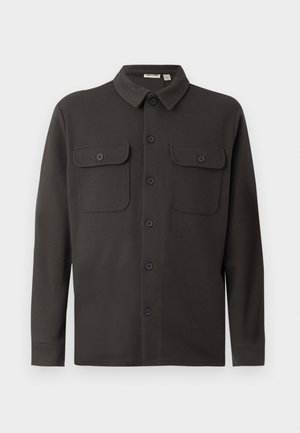 Dark gray button-up shirt made from soft fabric, featuring a collar, two chest pockets, and long sleeves with buttoned cuffs.