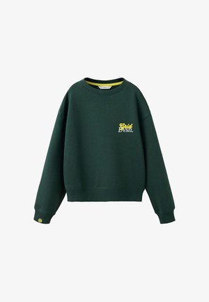 Sweat-shirt vert foncé à manches longues avec poignets et ourlet côtelés, texte "Grid Dvsn." jaune et blanc sur la poitrine, et une petite étiquette jaune au poignet gauche.