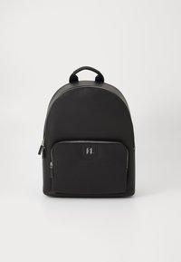 Black backpack with a rounded top, made of textured material, featuring a front zip pocket and a handle on top. Silver hardware accents.