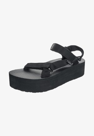 Schwarze Plattform-Sandale mit strukturiertem Fußbett, zwei Nylonriemen und einem hinteren Riemen zur Unterstützung. Hergestellt aus synthetischen Materialien.