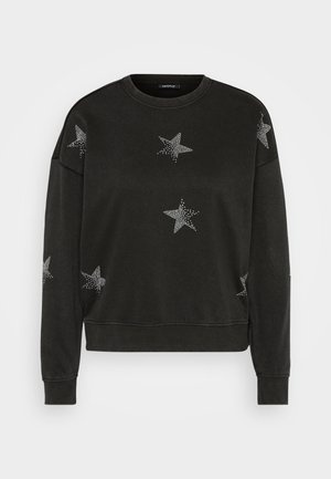 Felpa nera a maniche lunghe con collo tondo, decorata con motivi di stelle in strass bianchi sulla parte anteriore, sulle maniche e sulle spalle.