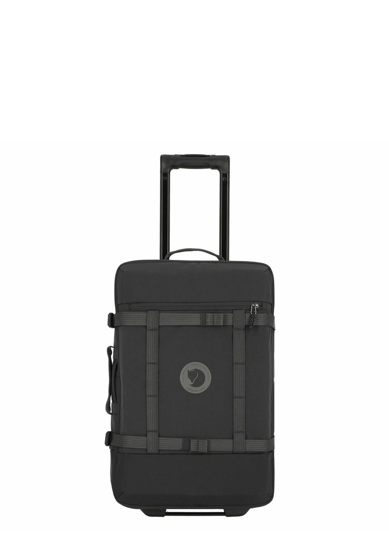 Black wheeled suitcase with a rectangular shape, made of durable fabric. Features a logo patch, straps, and a retractable handle.