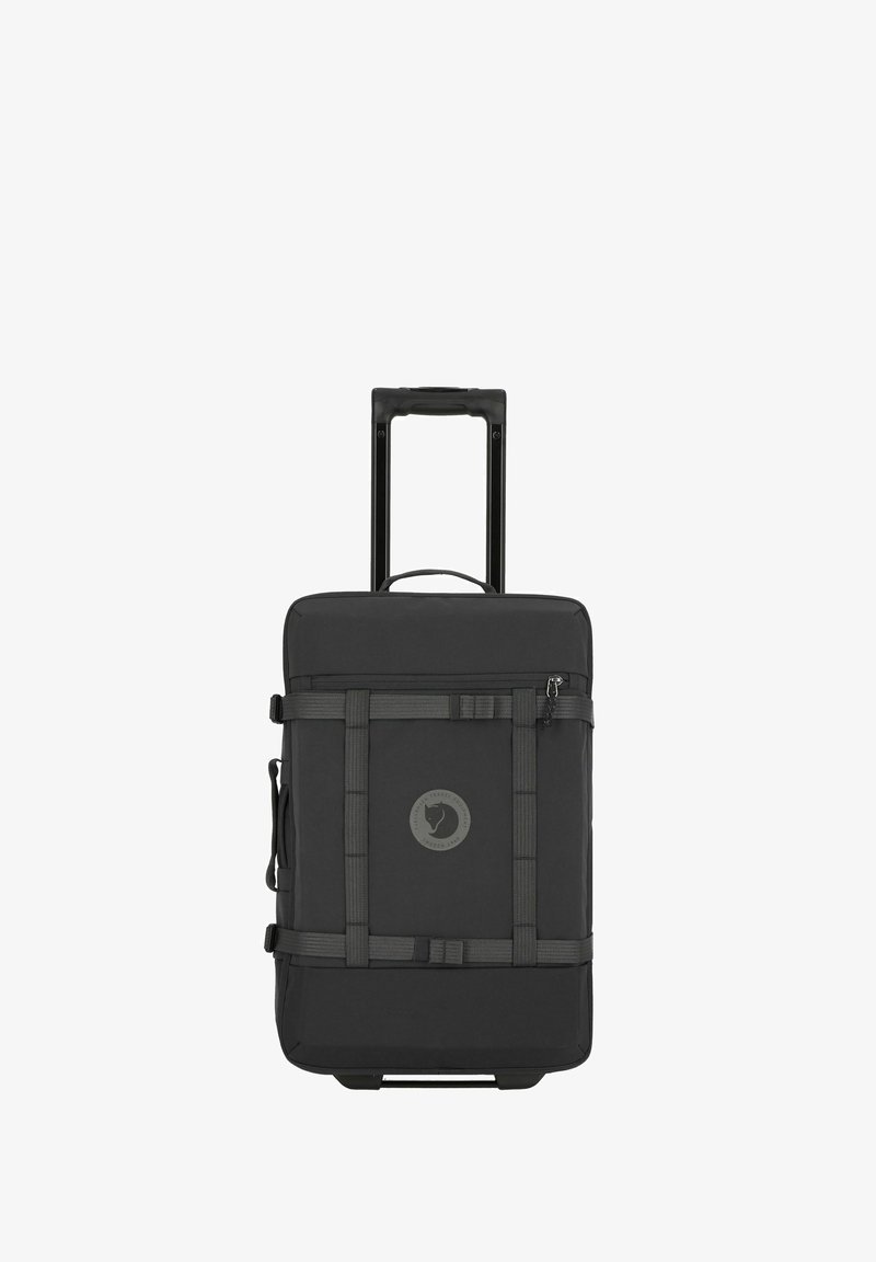 Black wheeled suitcase with a rectangular shape, made of durable fabric. Features a logo patch, straps, and a retractable handle.