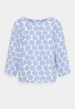 Chemise blanche à manches longues avec motifs abstraits circulaires bleu clair, col rond et coupe décontractée.
