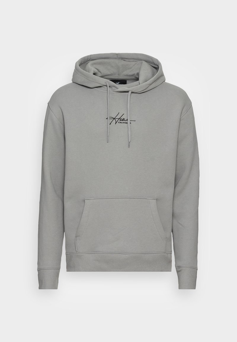 Grijze hoodie met een voorste kangoeroezak, trekkoord capuchon en een zwart scriptlogo op de borst. Zachte stof, ribbelmanchetten.