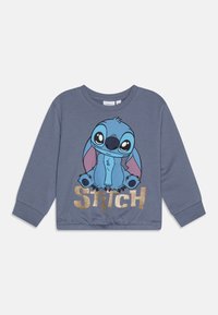 Grå hettegenser med et tegneserie-Print av Stitch i blått med store øyne, kombinert med "STITCH" i gullglitterbokstaver nederst.
