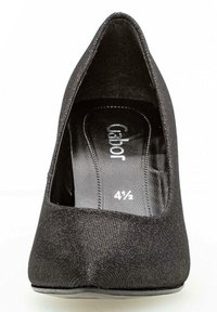 Schwarze hochhackige Pumps mit einem Obermaterial aus strukturiertem Stoff und einer spitzen Zehenpartie. Mit einer gepolsterten Innensohle und einem glatten Innenfutter. Größe 4½.
