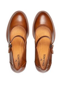 Chaussures Mary Jane en cuir marron avec des brides ajustables, bouts ronds et semelles rembourrées, vues de dessus sur un fond blanc.
