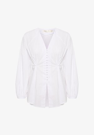 Bela bluzica iz bombaža z globokim V-izrezom, z gumbi z sprednje strani, nabranimi rokavi in zasukanim pasom. Gladka tekstura, lahka.